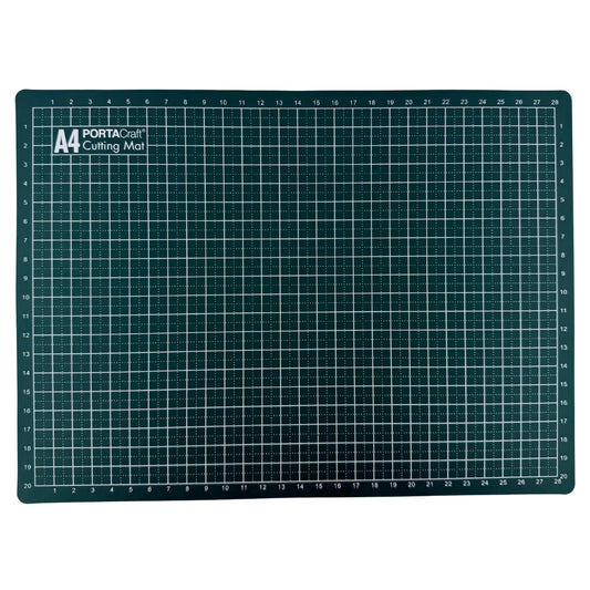 A dark green cutting mat with a white grid pattern and measurement markings from Porta Craft - Available at Discount Craft