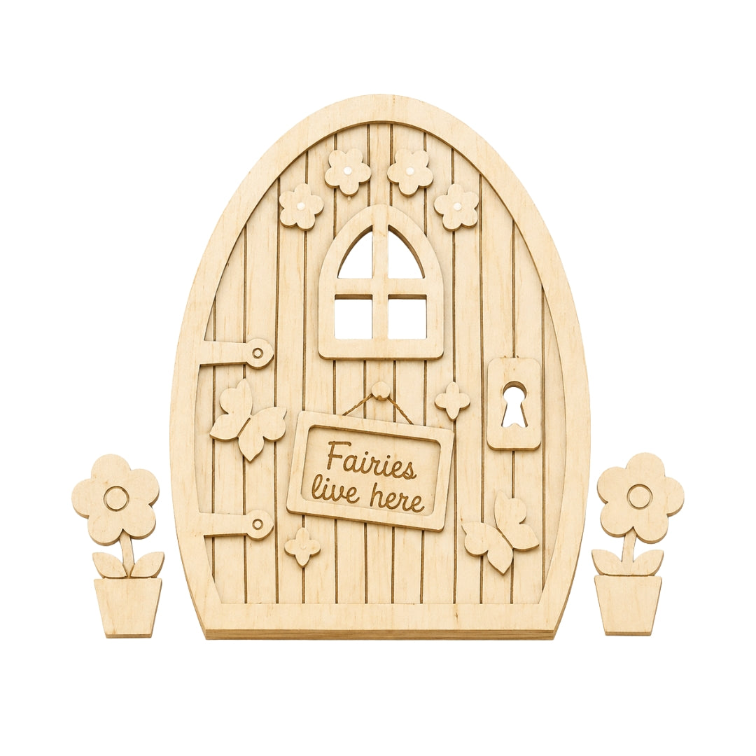 A wooden fairy door kit with an arched natural wood door featuring a window, decorative cutout flowers, a keyhole, and a sign that reads 'Fairies live here'. Two small flower pot cutouts are placed on either side of the door, all shown on a plain white background.